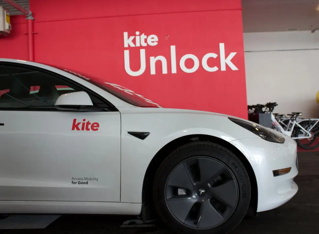 A Kite car parked at the Gallery Square hub by the Kite Unlock wall